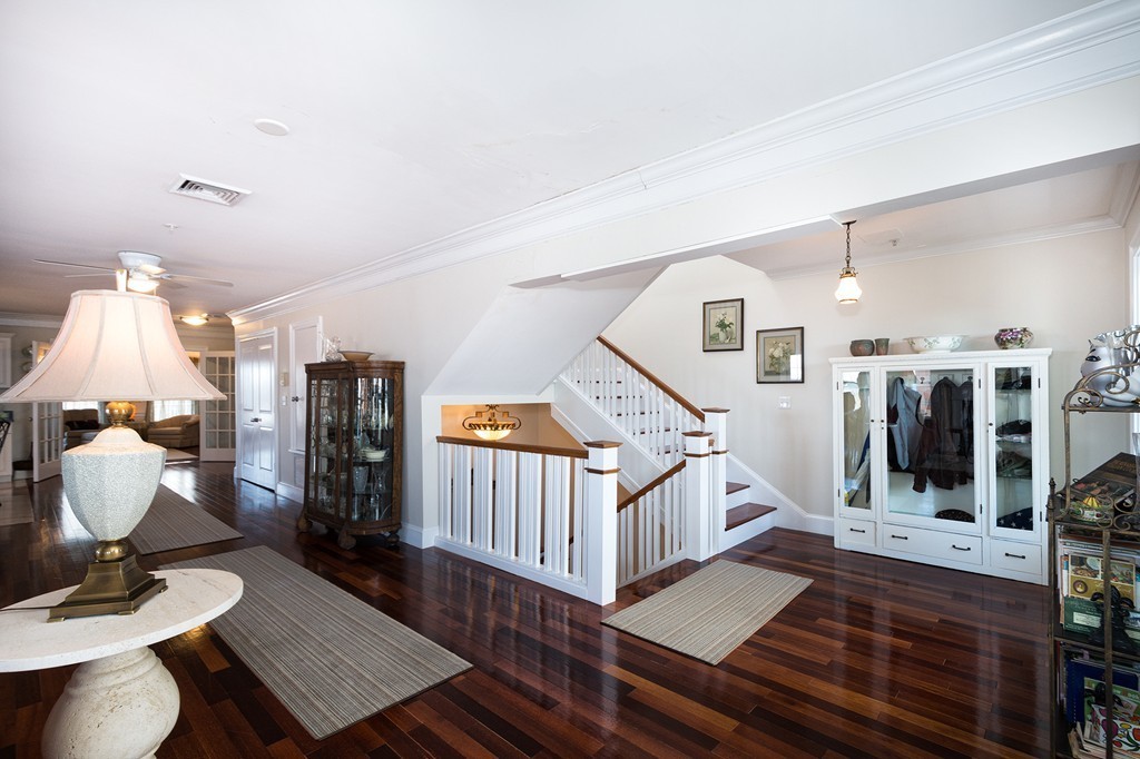 15 Park Avenue, Unit 401 Hull, MA 02045 - Photo 2 of 24 a room with lots of white furniture and wooden floor