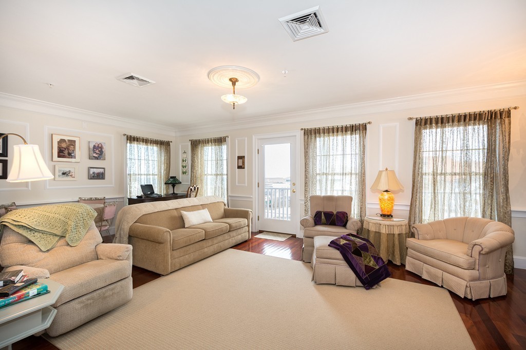 15 Park Avenue, Unit 401 Hull, MA 02045 - Photo 9 of 24 a living room with furniture and a large window