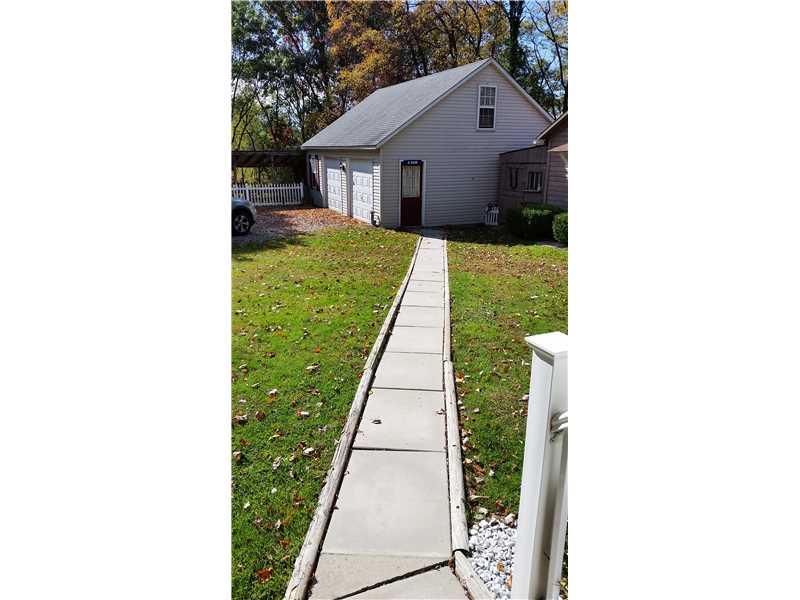 369 Locust Hill Road Cheswick, PA 15024 - Photo 5 of 17 Parking Lot/Garage. This is the walk way from the side entrance to the garage little house