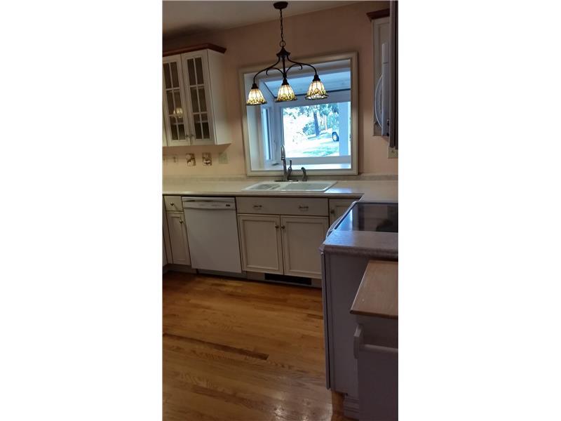 369 Locust Hill Road Cheswick, PA 15024 - Photo 10 of 17 Kitchen. Bright, white kitchen with a large window to see when your guests are arriving.