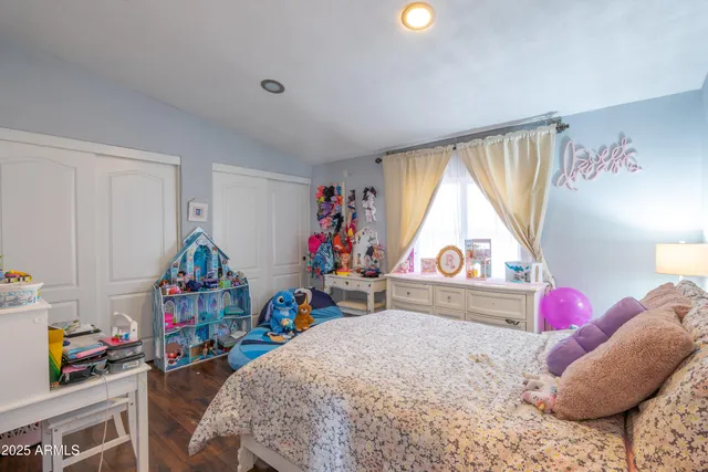 a bed room with a bed and a window