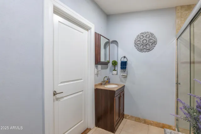 a bathroom with a sink and a mirror