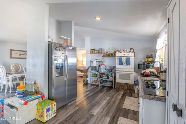 a bedroom with furniture and a book shelf