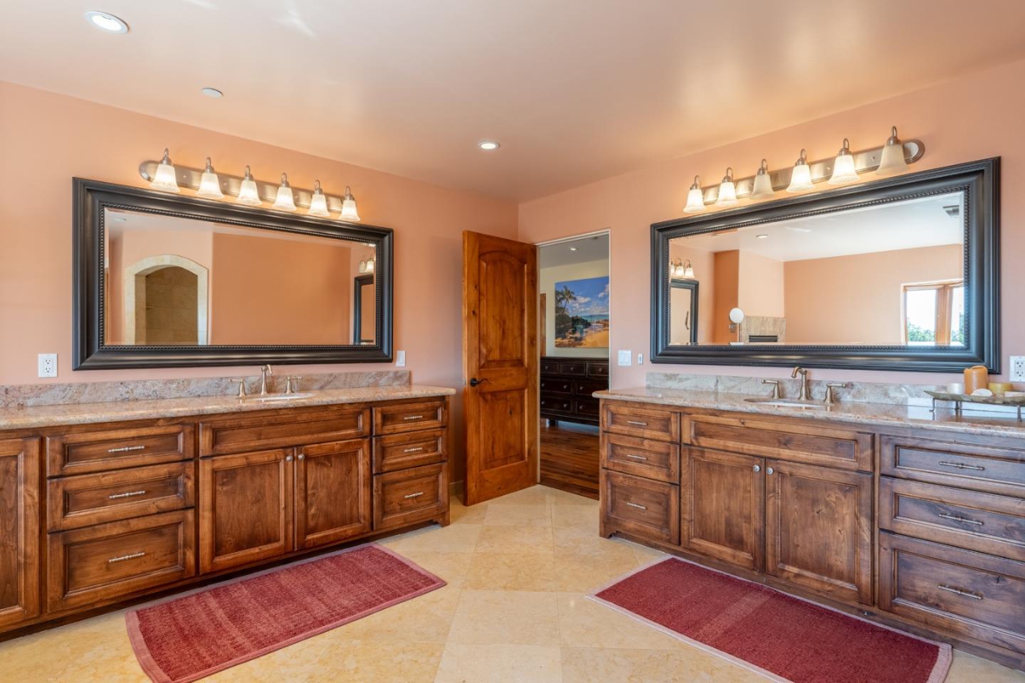 67 Tucker Road Watsonville, CA 95076 - Photo 14 of 32 a bathroom with a toilet sink and mirror