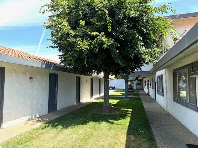 1261 Juniper Drive, Unit 12 Gilroy, CA 95020 - Photo 2 of 9 a front view of a house with a yard
