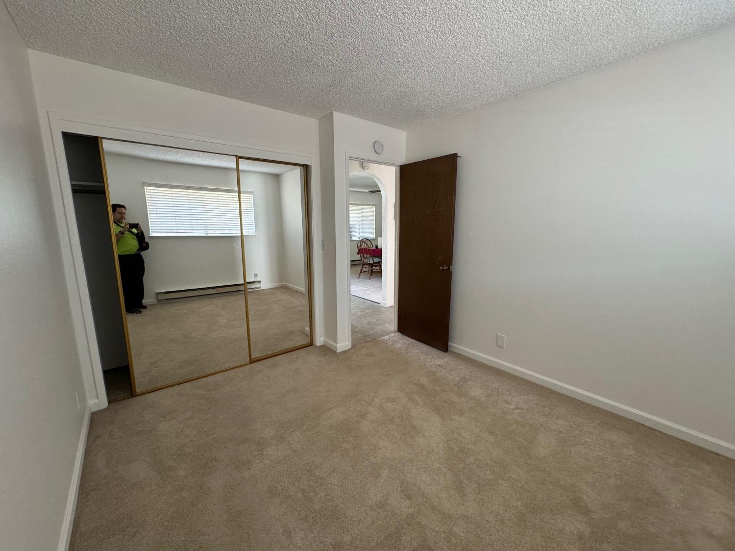 1261 Juniper Drive, Unit 12 Gilroy, CA 95020 - Photo 5 of 9 a view of an empty room with closet and a bathroom