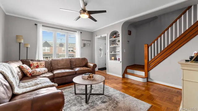 a living room with furniture and a dining table