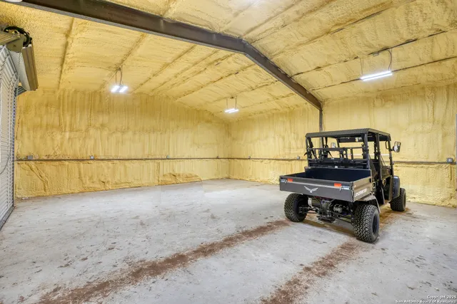 a view of a lobby with a floor to ceiling window and wooden floor