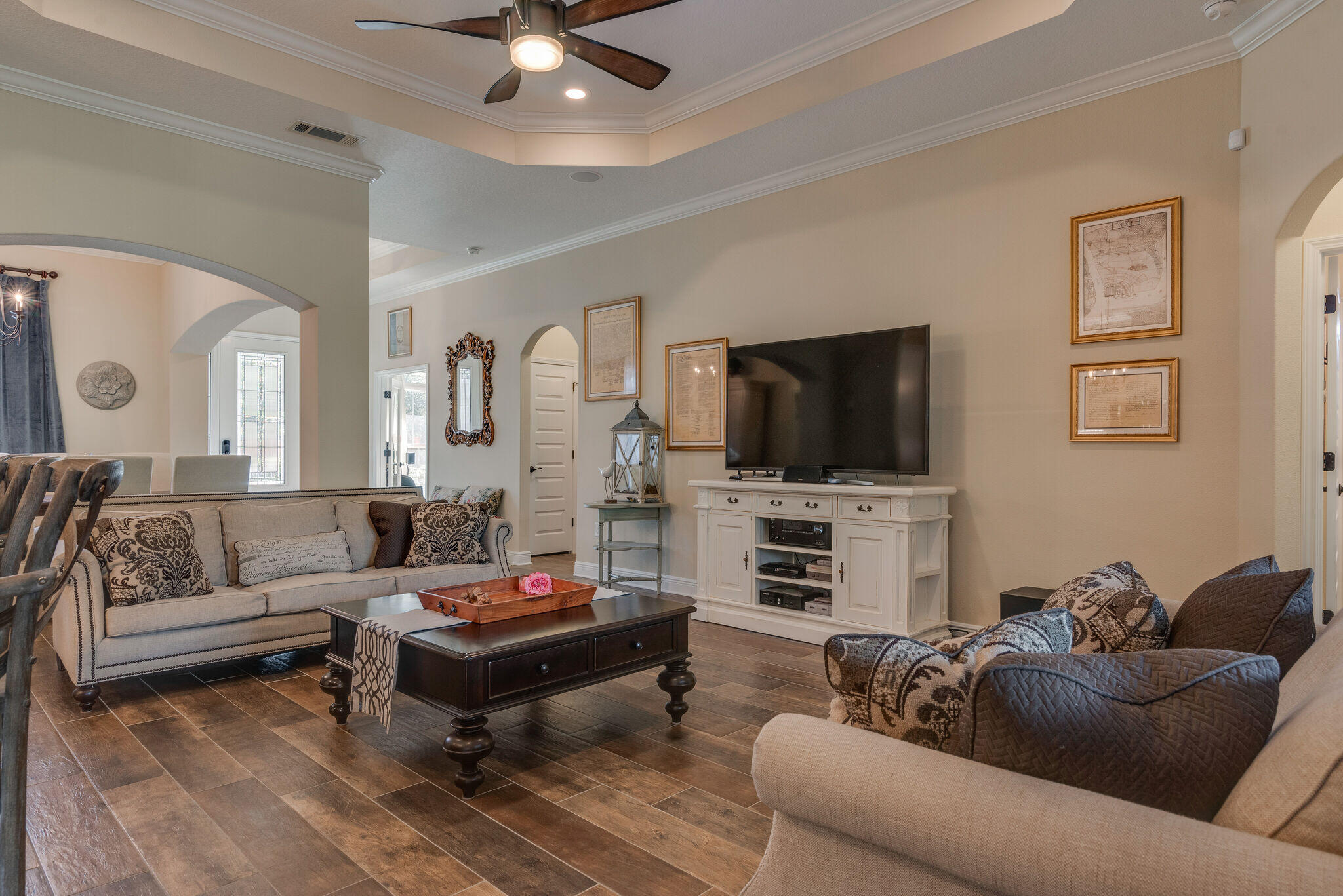 8640 Sand Pine Drive Navarre, FL 32566 - Photo 13 of 58 a living room with furniture and a flat screen tv