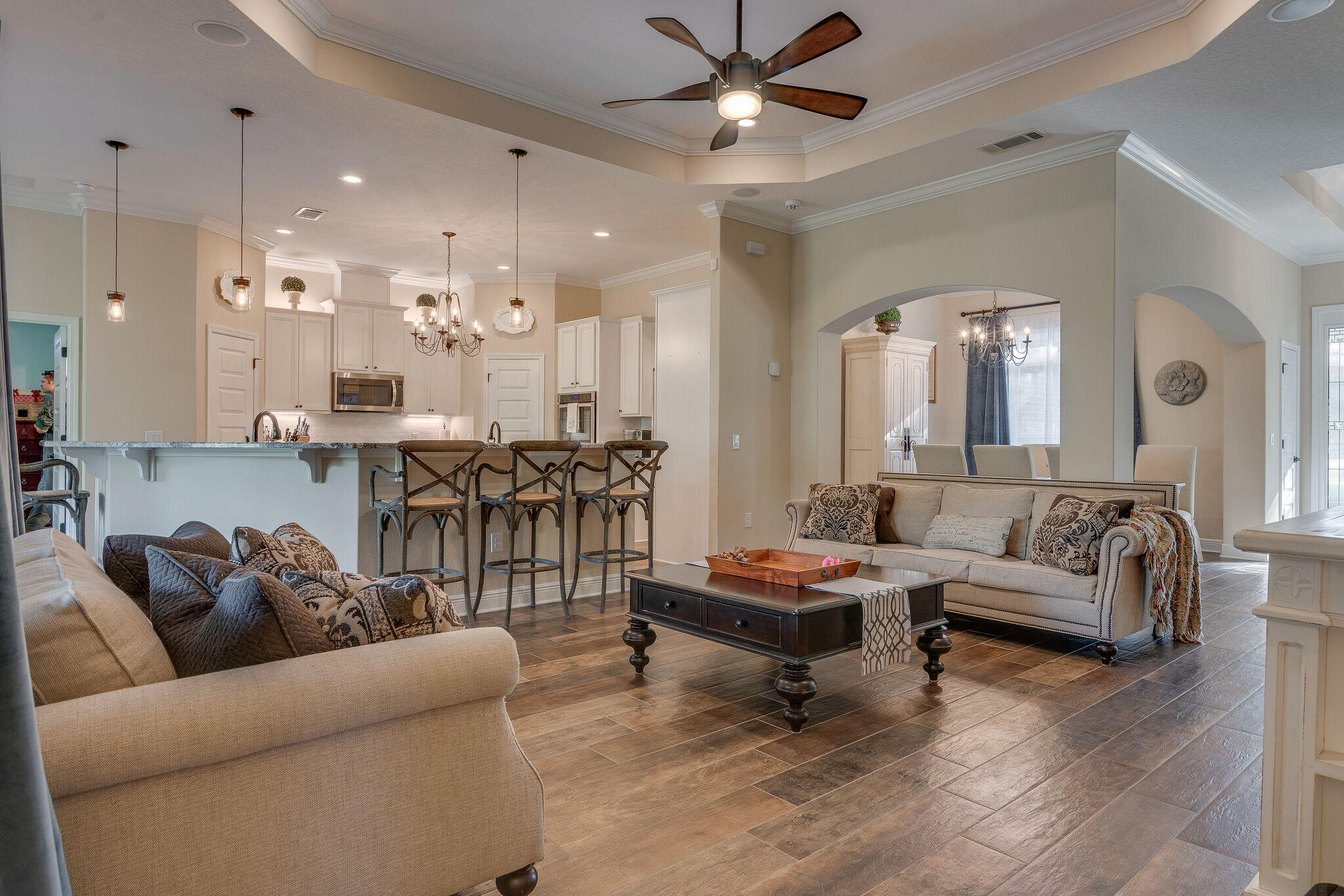 8640 Sand Pine Drive Navarre, FL 32566 - Photo 14 of 58 a living room with furniture and a chandelier