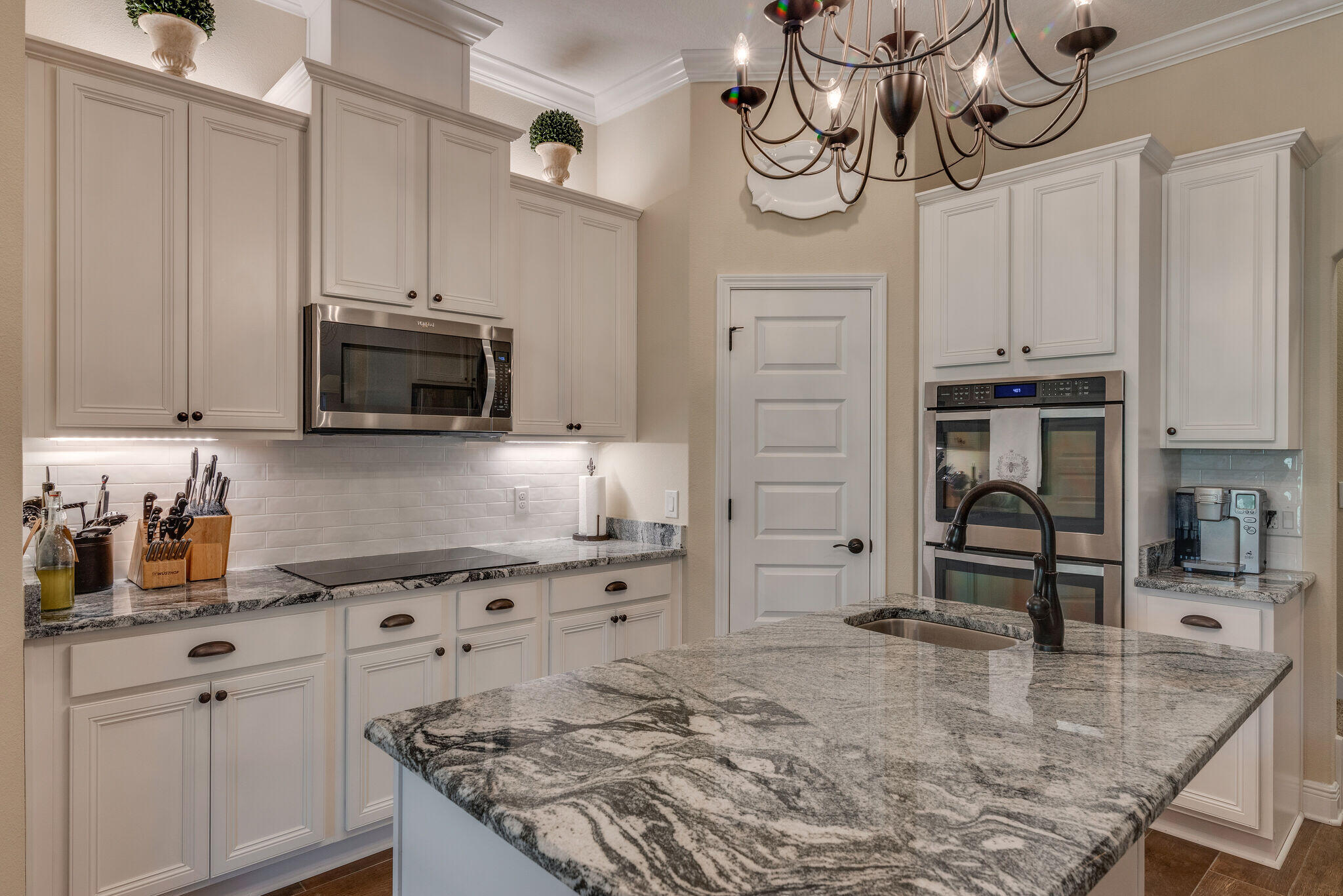 8640 Sand Pine Drive Navarre, FL 32566 - Photo 18 of 58 a kitchen with stainless steel appliances granite countertop a sink a stove and cabinets