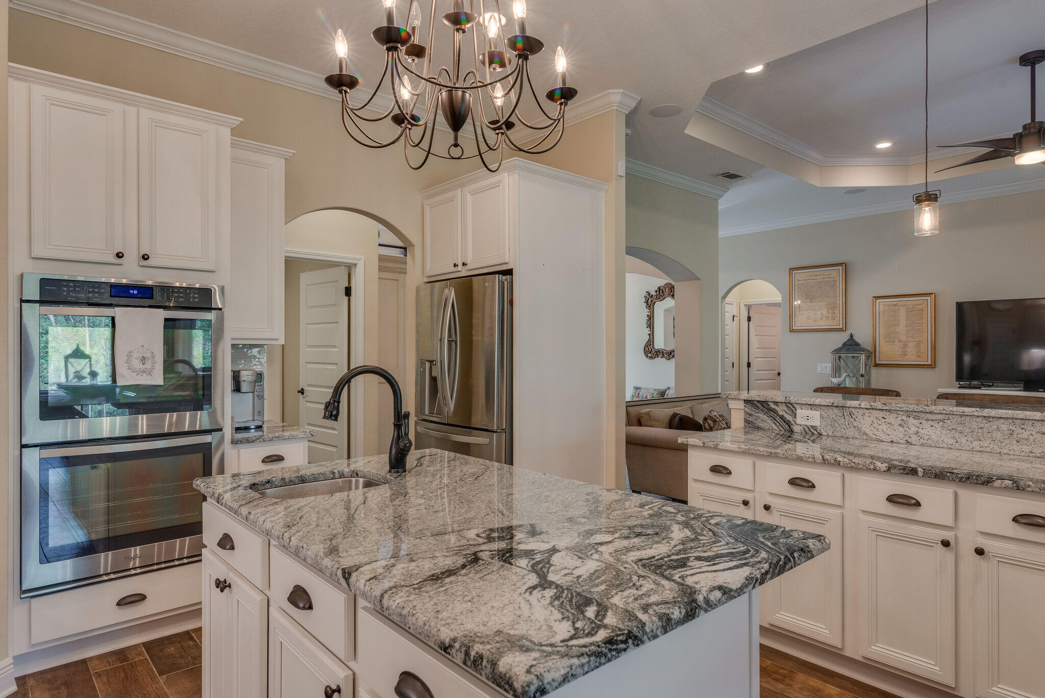 8640 Sand Pine Drive Navarre, FL 32566 - Photo 20 of 58 a kitchen with a sink a stove and cabinets