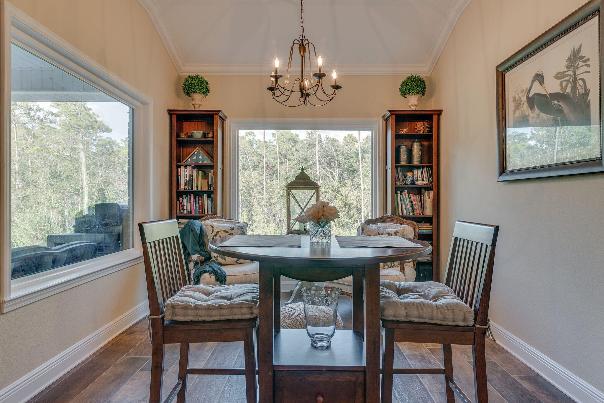 8640 Sand Pine Drive Navarre, FL 32566 - Photo 21 of 58 a view of a dining room with furniture window and wooden floor