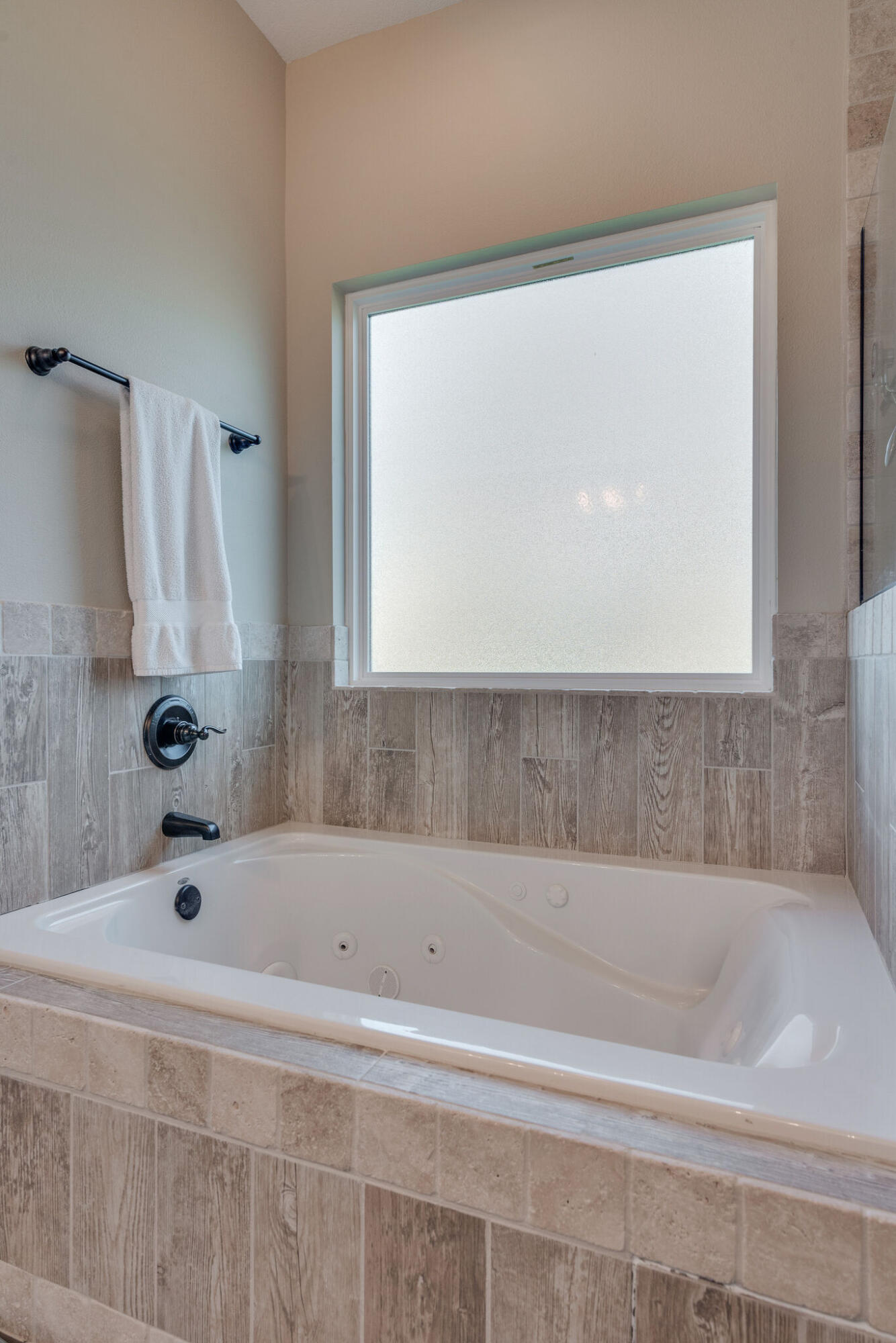 8640 Sand Pine Drive Navarre, FL 32566 - Photo 26 of 58 a bathroom with a bathtub and a shower