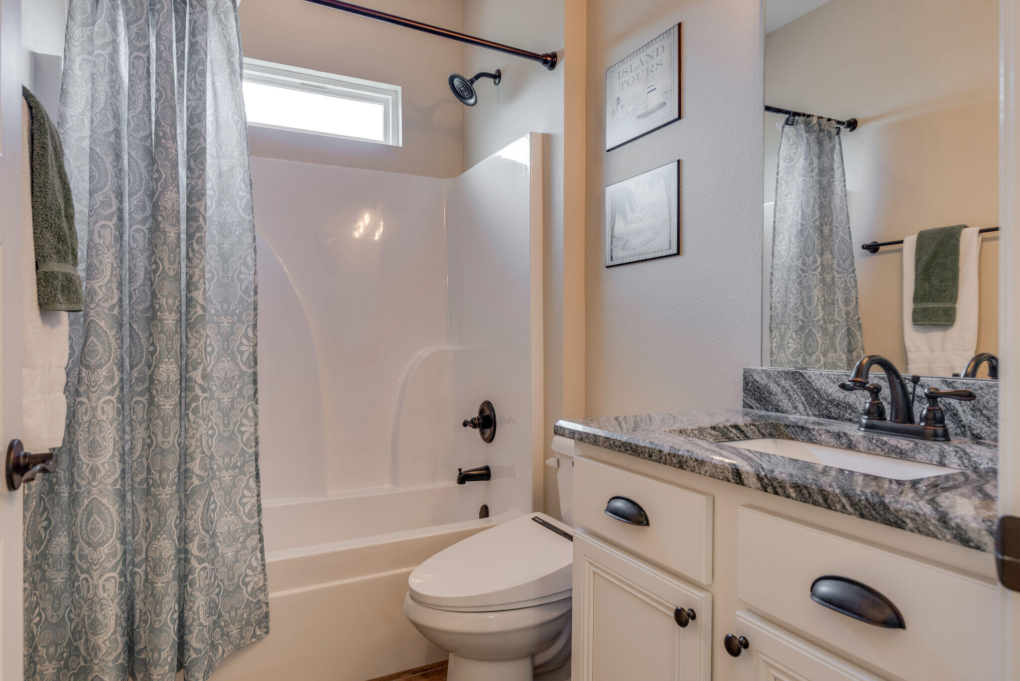 8640 Sand Pine Drive Navarre, FL 32566 - Photo 29 of 58 a bathroom with a granite countertop sink toilet and shower