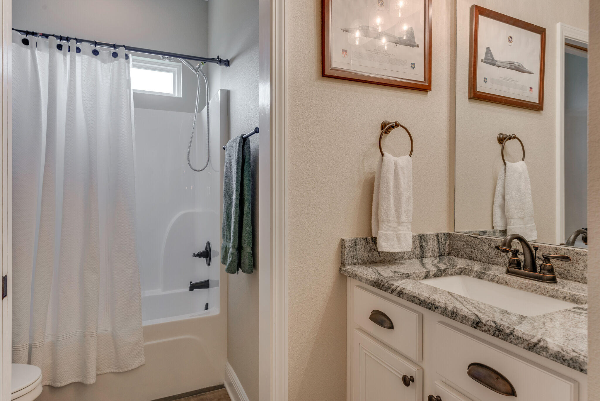 8640 Sand Pine Drive Navarre, FL 32566 - Photo 32 of 58 a bathroom with a granite countertop sink and a mirror a shower