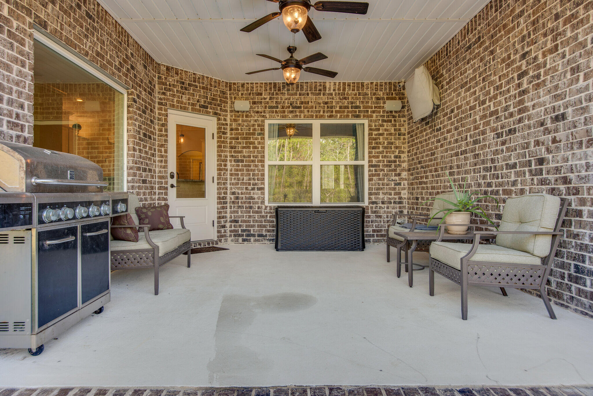 8640 Sand Pine Drive Navarre, FL 32566 - Photo 37 of 58 a living room with furniture and a chandelier