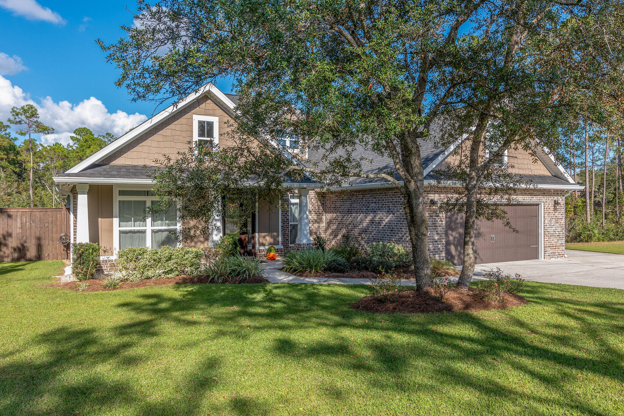 8640 Sand Pine Drive Navarre, FL 32566 - Photo 4 of 58 a view of a house with a yard and sitting area