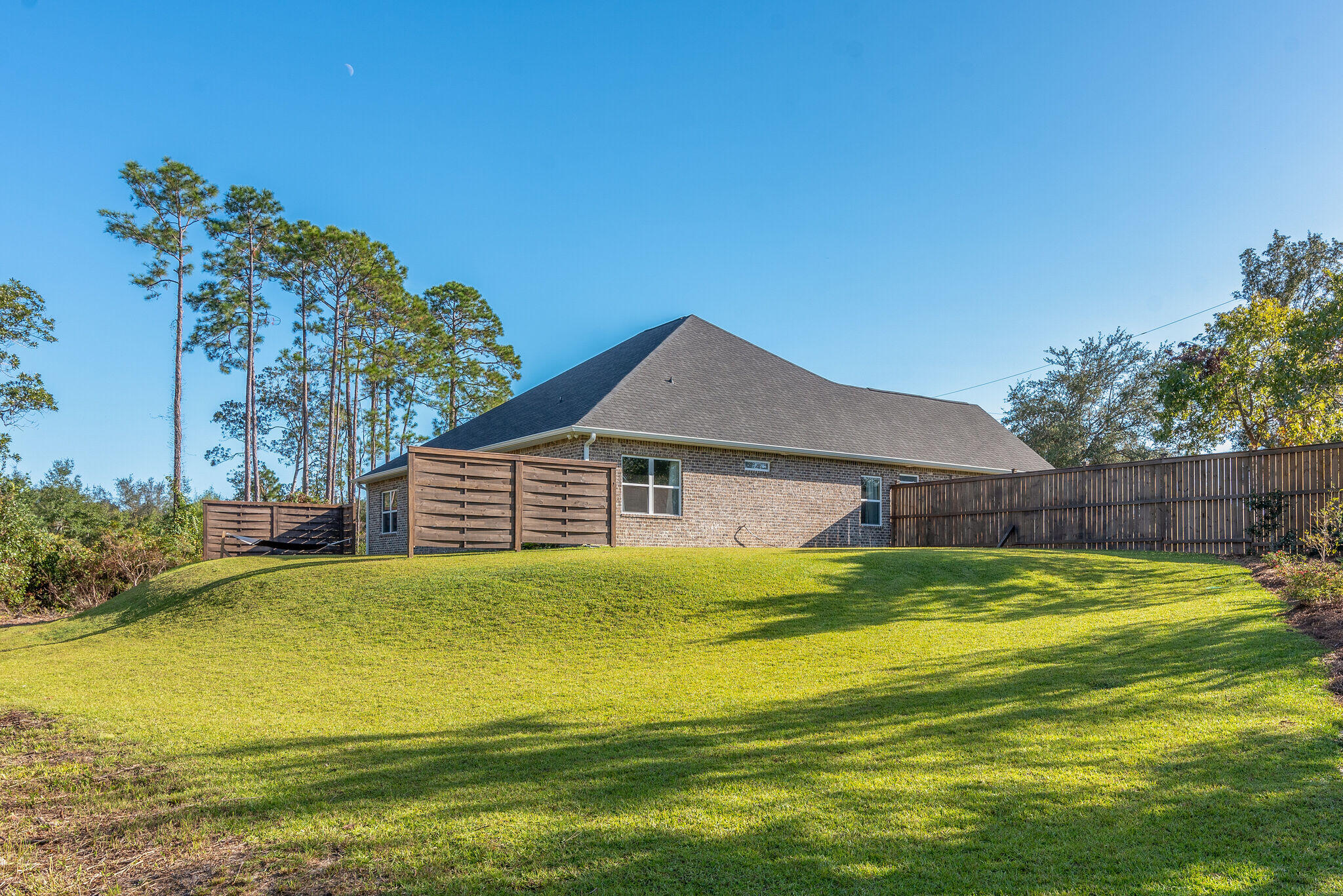 8640 Sand Pine Drive Navarre, FL 32566 - Photo 43 of 58 a view of a house with a big yard