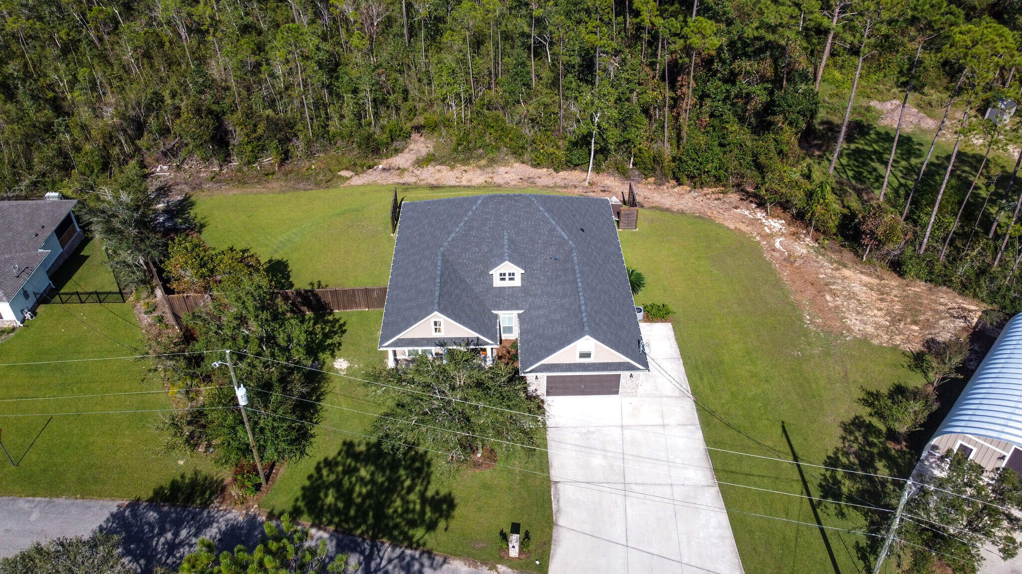 8640 Sand Pine Drive Navarre, FL 32566 - Photo 53 of 58 an aerial view of a house