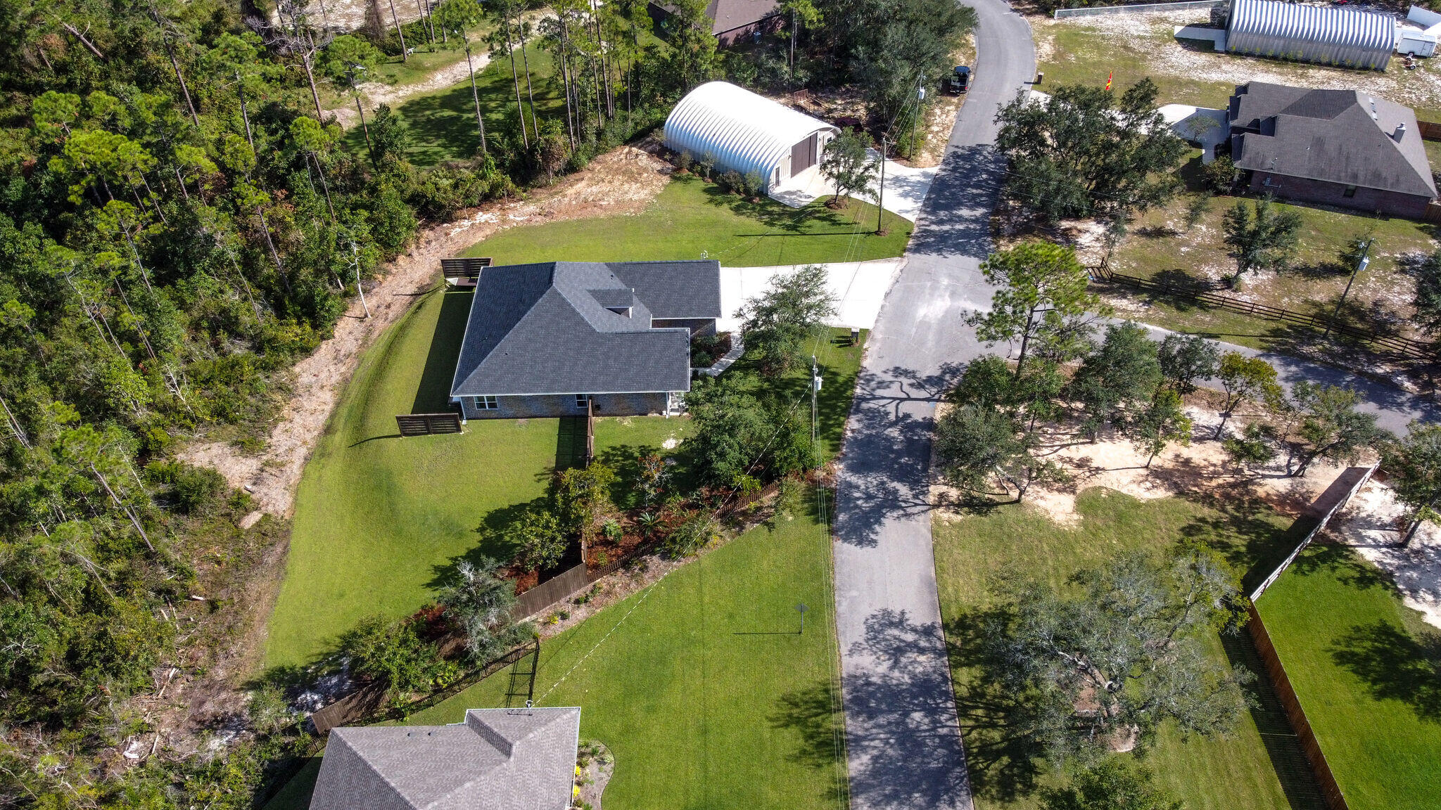 8640 Sand Pine Drive Navarre, FL 32566 - Photo 58 of 58 an aerial view of a house