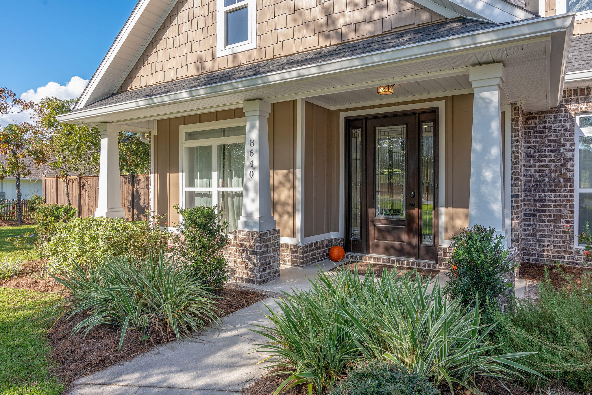 8640 Sand Pine Drive Navarre, FL 32566 - Photo 6 of 58 front view of a house
