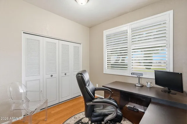 a bathroom with a sink a toilet and a large mirror