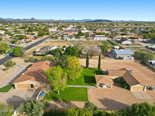 an aerial view of residential houses with outdoor space and river