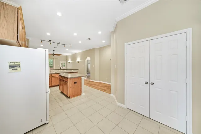 a kitchen with stainless steel appliances a refrigerator and a sink