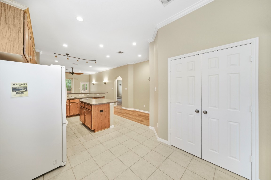2989 Peacemaker Street Round Rock, TX 78681 - Photo 19 of 40 a kitchen with stainless steel appliances a refrigerator and a sink
