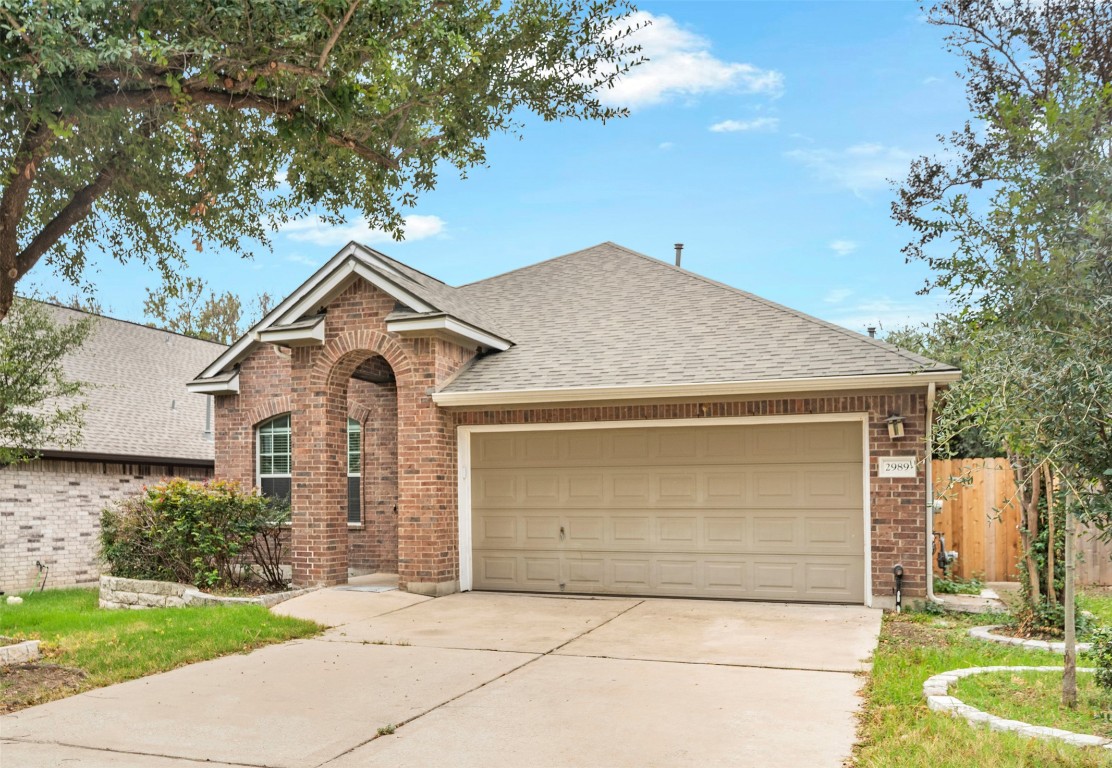 2989 Peacemaker Street Round Rock, TX 78681 - Photo 2 of 40 a front view of a house with garden