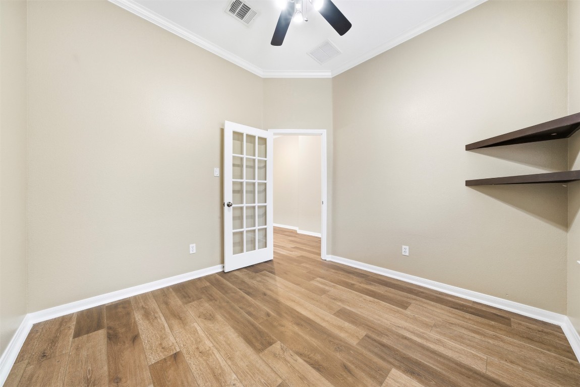 2989 Peacemaker Street Round Rock, TX 78681 - Photo 23 of 40 an empty room with wooden floor closet and windows