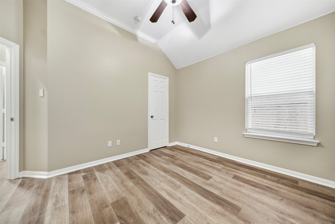 2989 Peacemaker Street Round Rock, TX 78681 - Photo 25 of 40 a view of an empty room with window and a ceiling fan