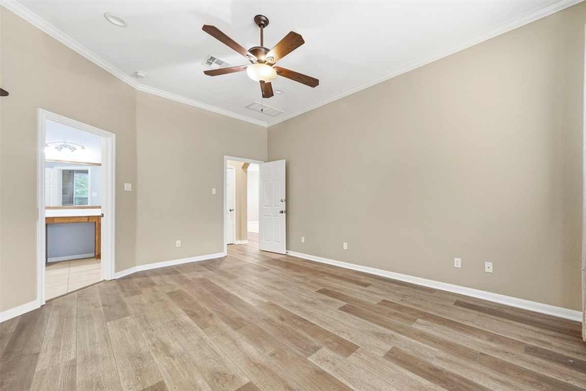2989 Peacemaker Street Round Rock, TX 78681 - Photo 28 of 40 wooden floor in an empty room with a window