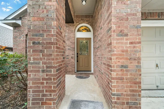 a view of a brick house with a door