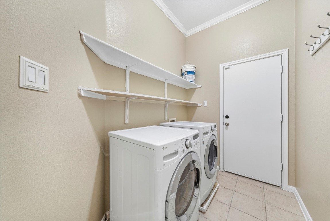 2989 Peacemaker Street Round Rock, TX 78681 - Photo 35 of 40 a utility room with dryer and washer