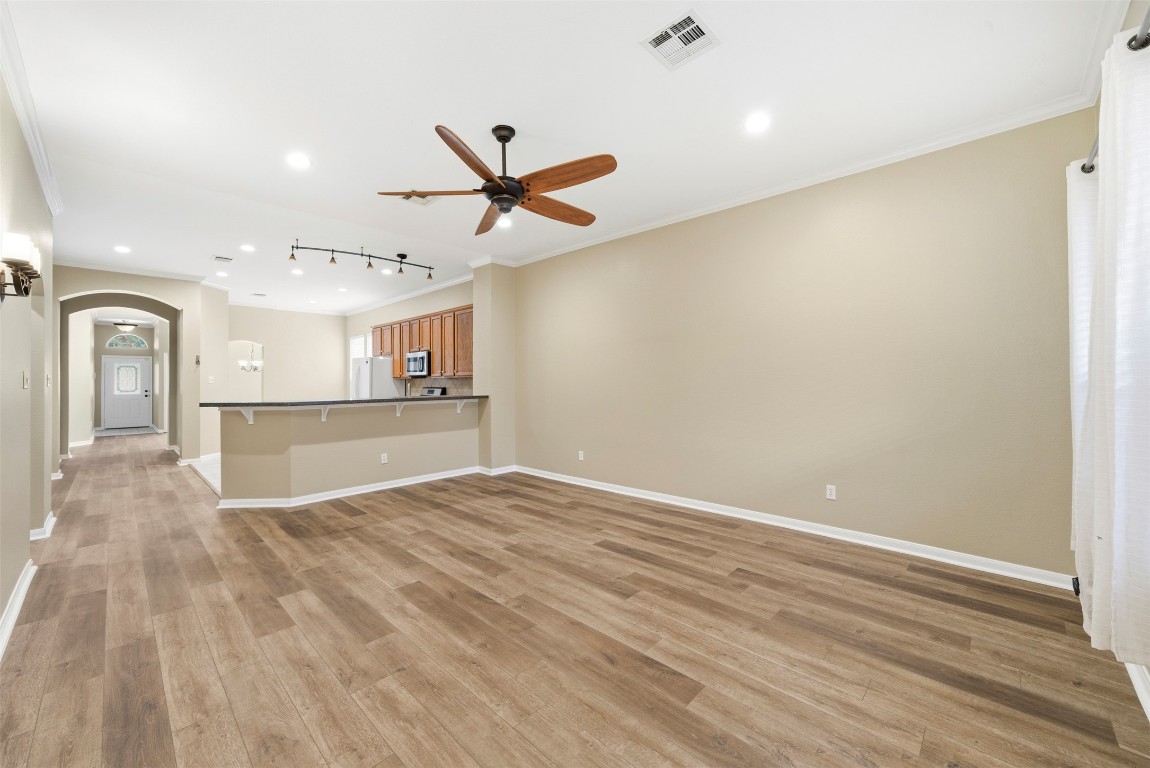 2989 Peacemaker Street Round Rock, TX 78681 - Photo 6 of 40 wooden floor in an empty room with a window