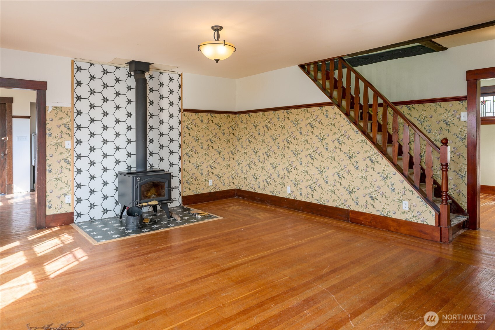 5625 Fisherman Bay Road Lopez Island, WA 98261 - Photo 17 of 40 a view of a livingroom with wooden floor and a fireplace