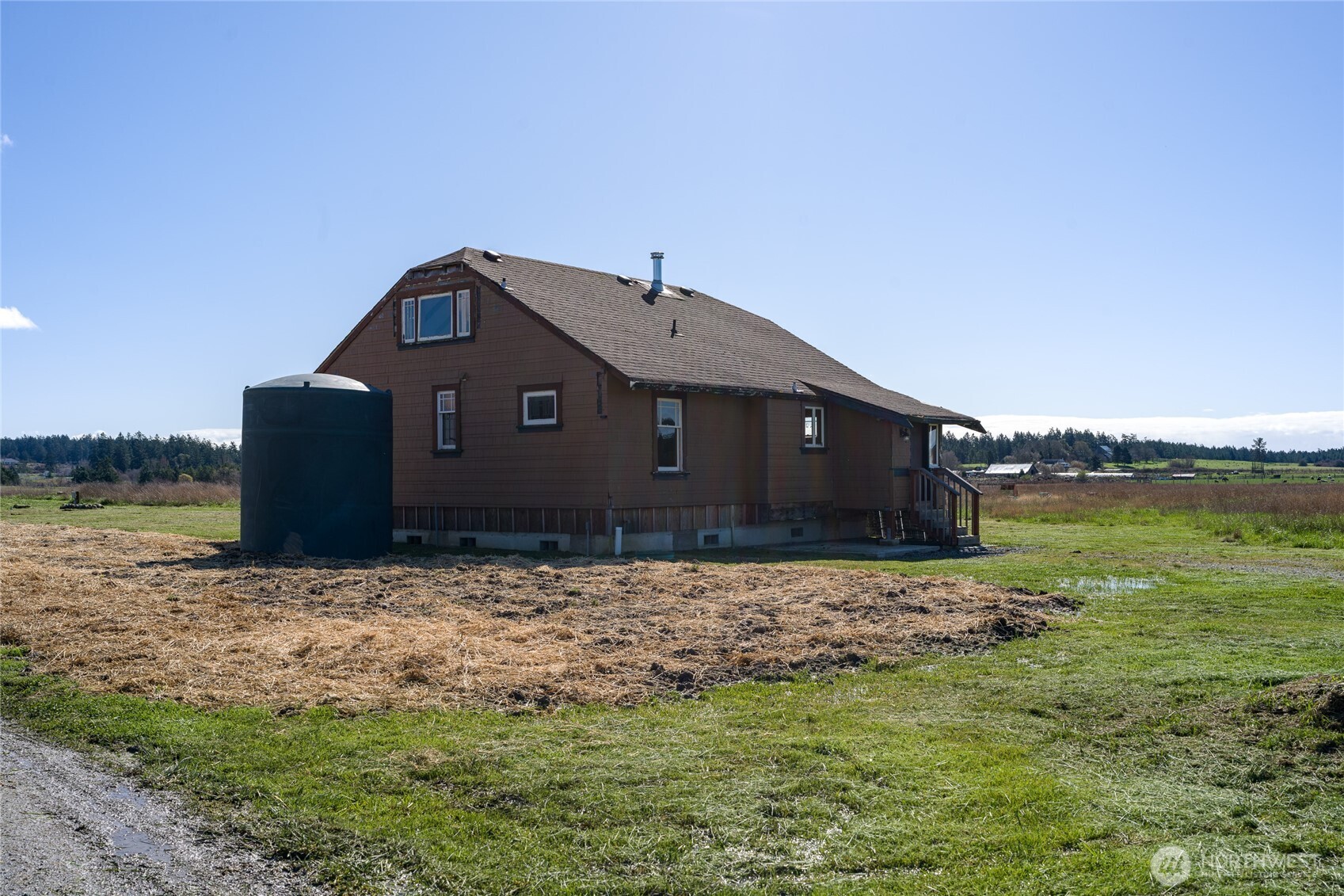 5625 Fisherman Bay Road Lopez Island, WA 98261 - Photo 31 of 40 a front view of a house with a yard