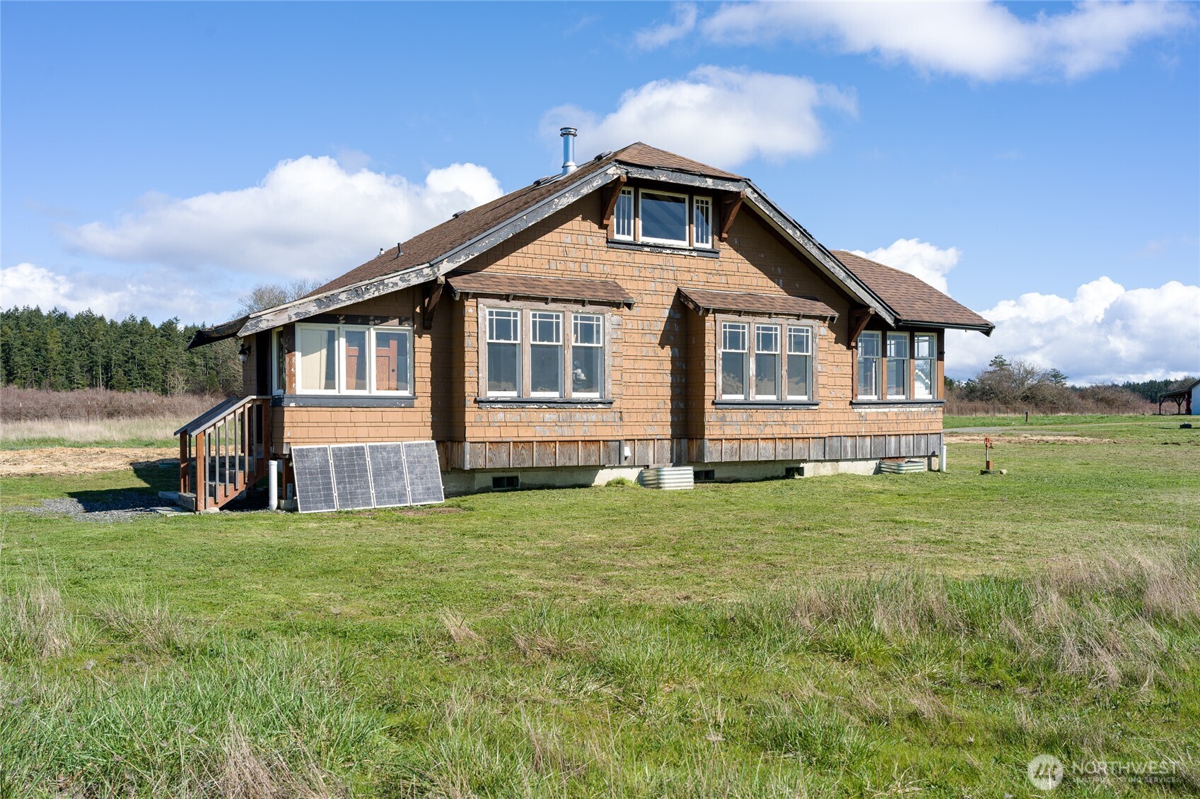 5625 Fisherman Bay Road Lopez Island, WA 98261 - Photo 32 of 40 a front view of a house with a yard