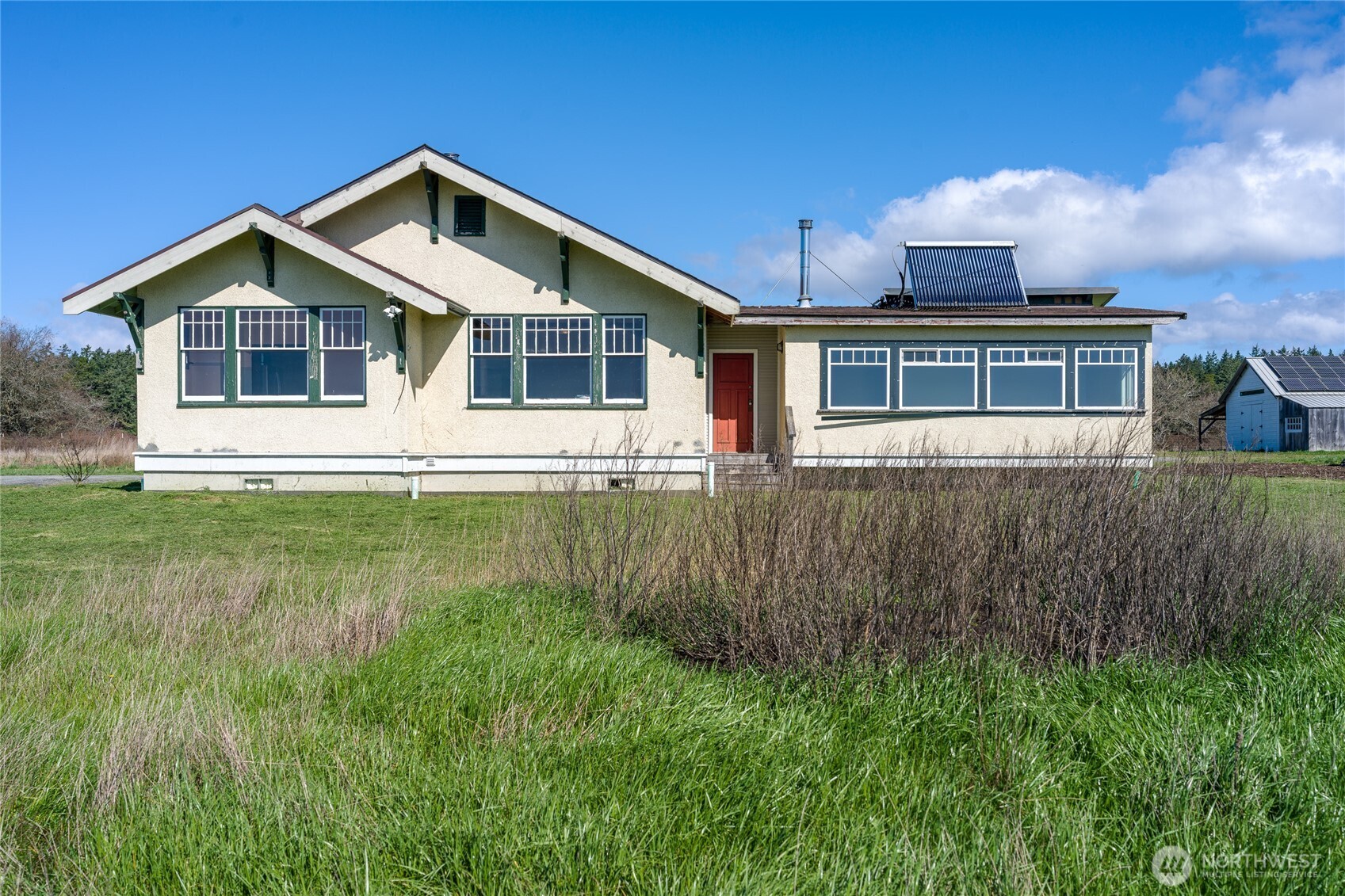 5625 Fisherman Bay Road Lopez Island, WA 98261 - Photo 36 of 40 a front view of a house with a yard