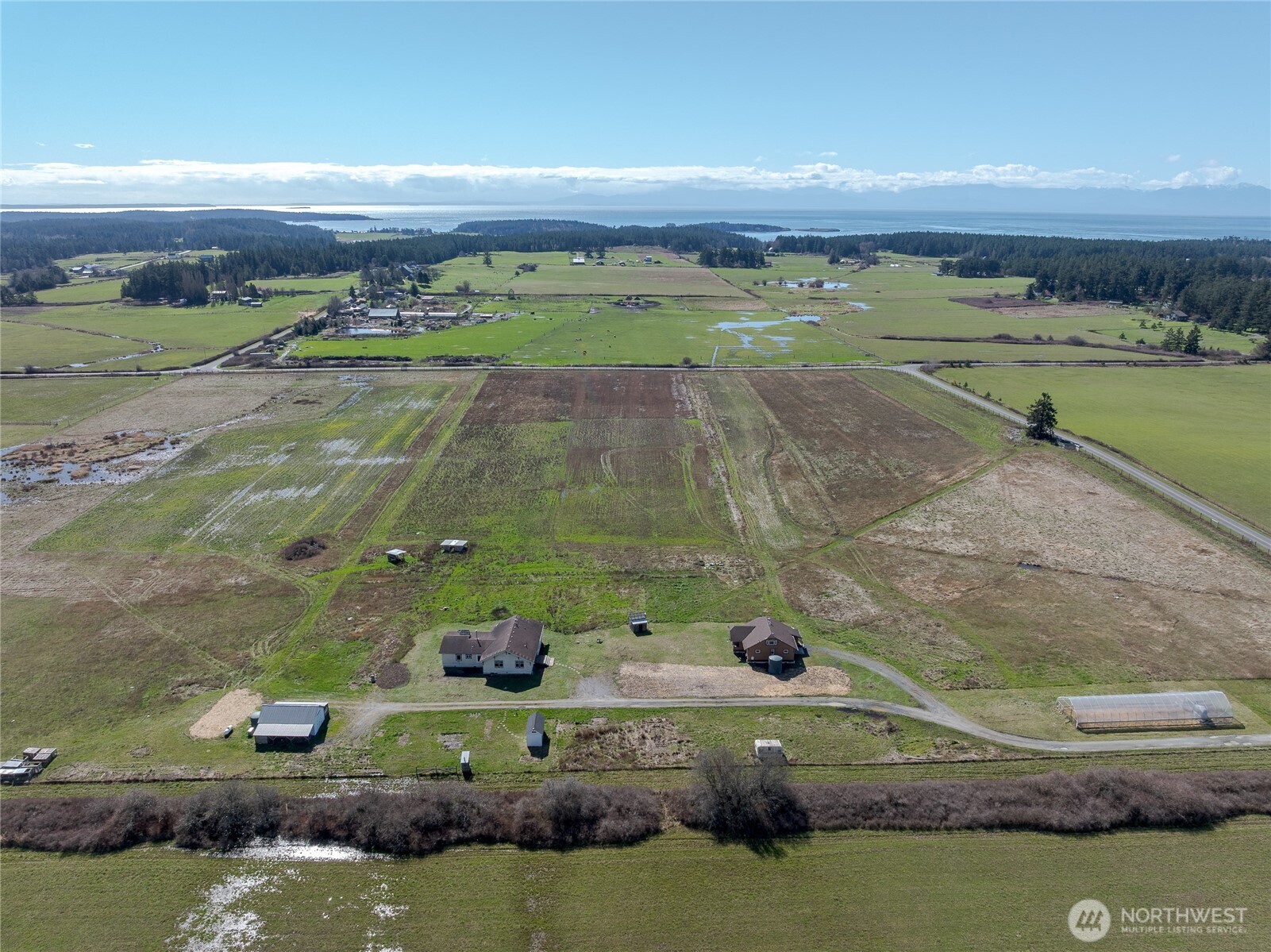 5625 Fisherman Bay Road Lopez Island, WA 98261 - Photo 7 of 40 an aerial view of a houses with outdoor space