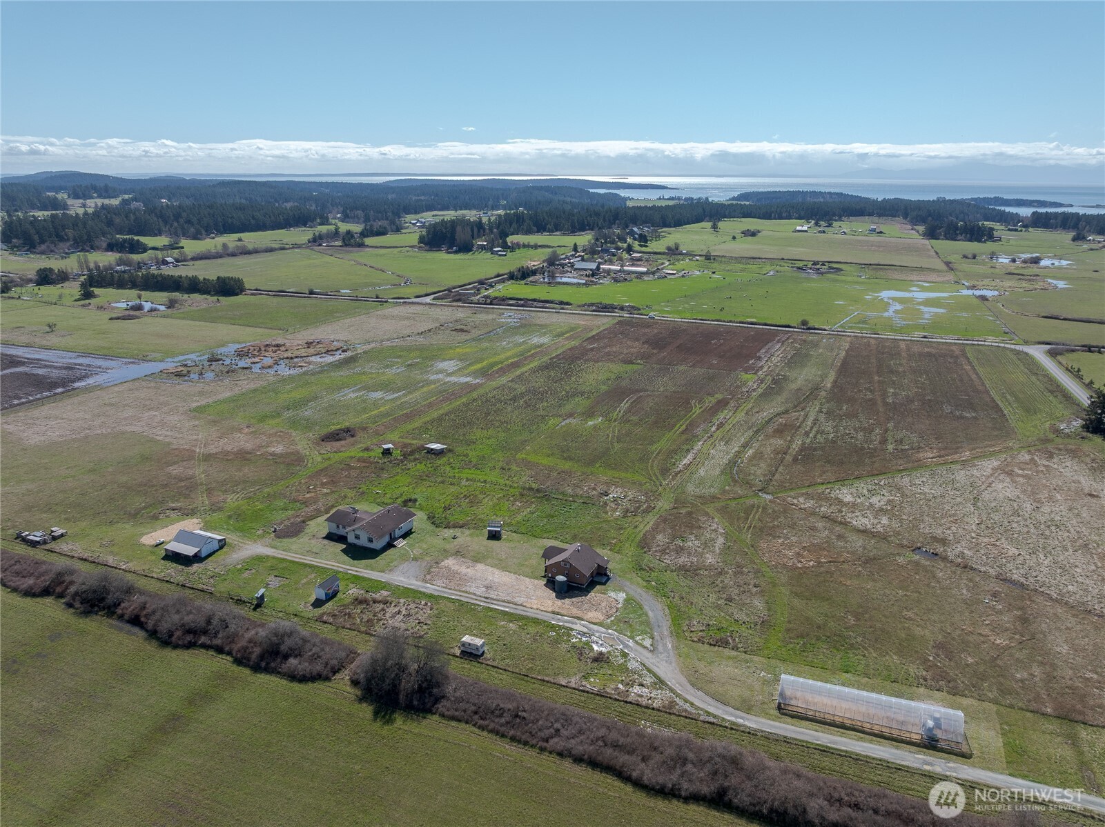 5625 Fisherman Bay Road Lopez Island, WA 98261 - Photo 8 of 40 an aerial view of a residential houses with outdoor space