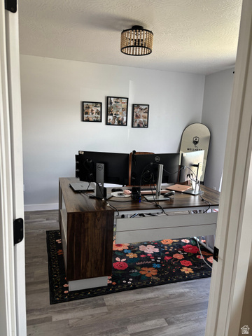 1324 West Raintree Drive, Unit 44 Price, UT 84501 - Photo 5 of 25 Light-toned wood-finish flooring provides a neutral base for this room