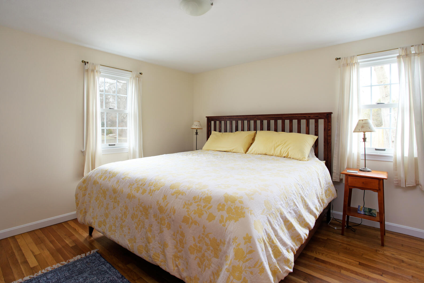 31 Kencomsett Circle Yarmouth Port, MA 02675 - Photo 13 of 19 a large bed sitting in a bedroom next to a window
