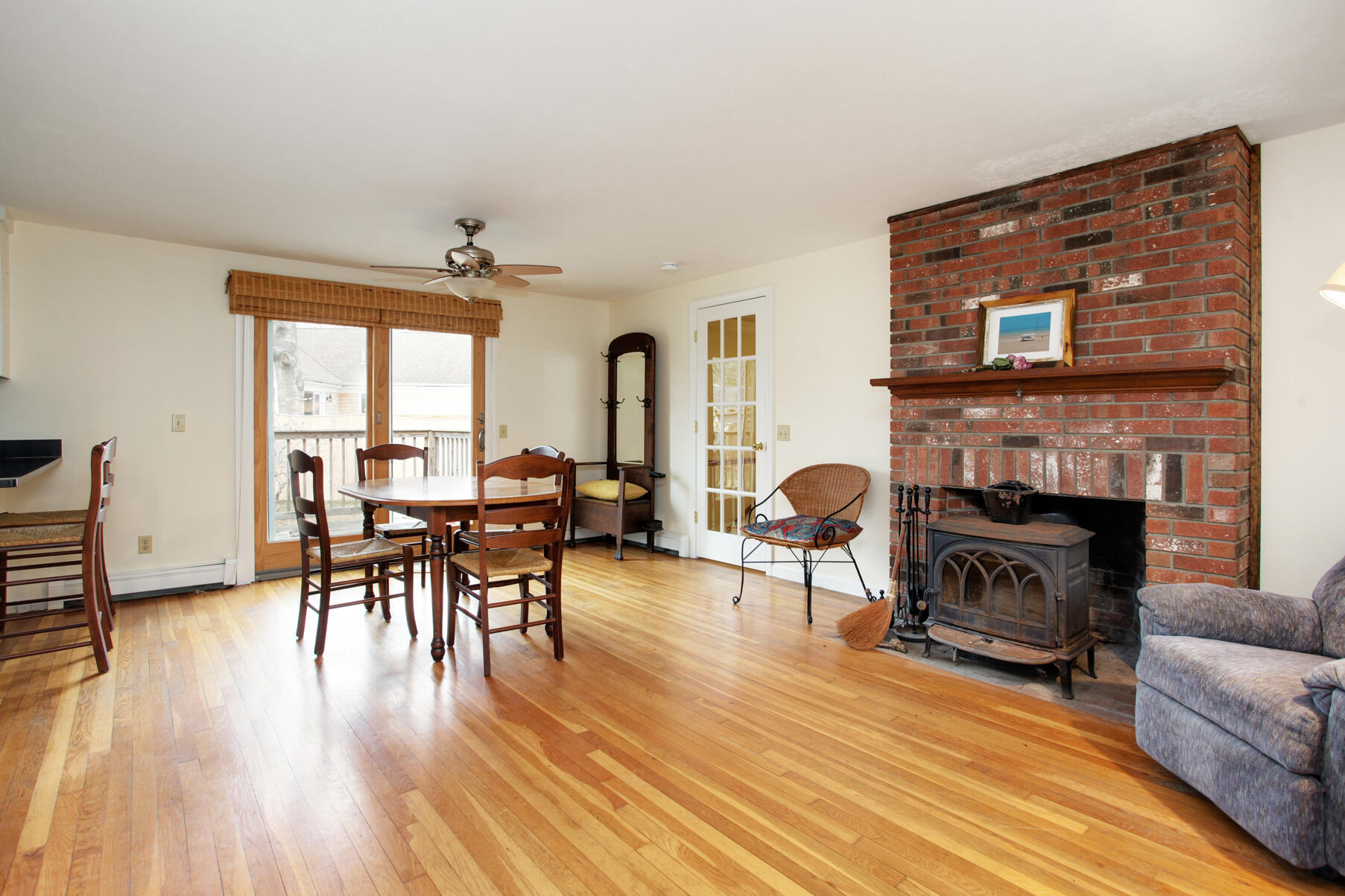 31 Kencomsett Circle Yarmouth Port, MA 02675 - Photo 3 of 19 a living room with furniture and a fireplace