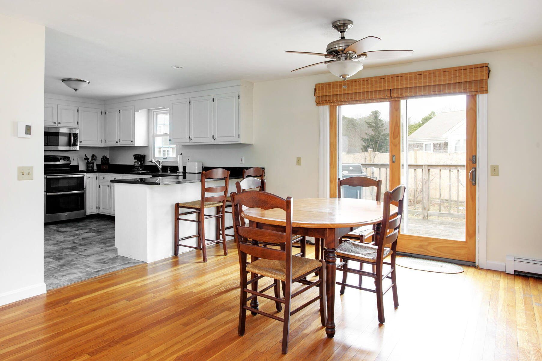 31 Kencomsett Circle Yarmouth Port, MA 02675 - Photo 5 of 19 a view of a dining room with furniture window and wooden floor