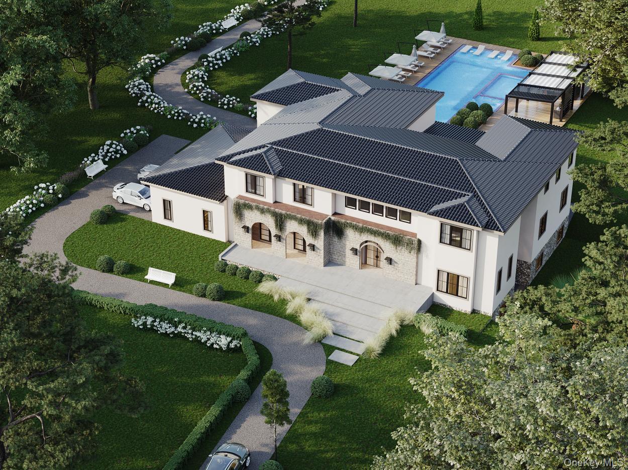 an aerial view of a house with garden space and street view