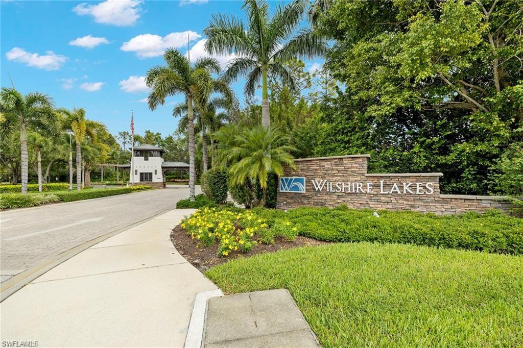3745 Fieldstone Boulevard, Unit 107 Naples, FL 34109 - Photo 1 of 14 View of community / neighborhood sign