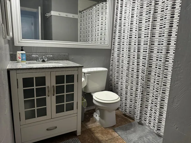 a bathroom with a toilet and a sink